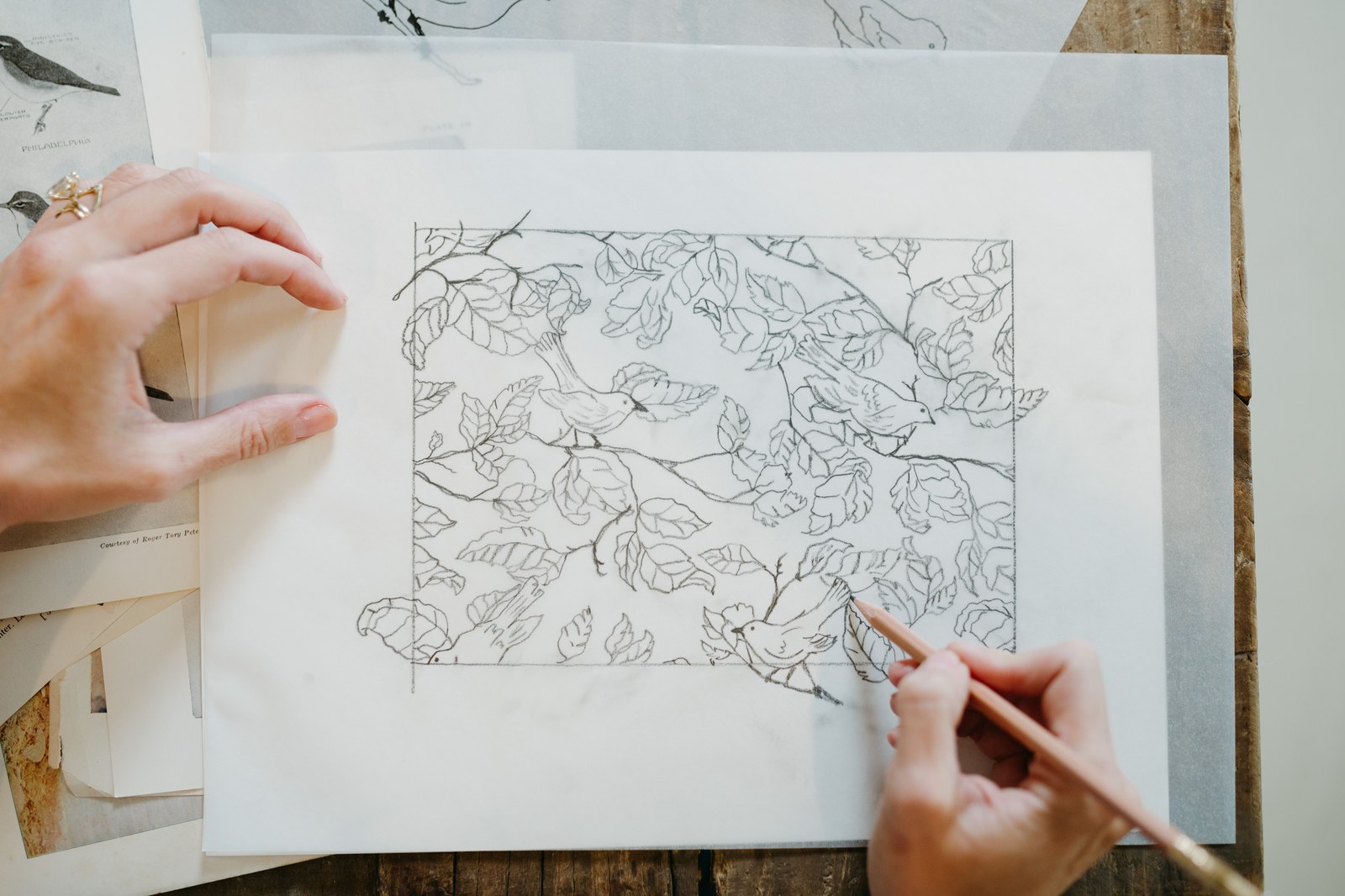 Hands framing a repeat sketch
